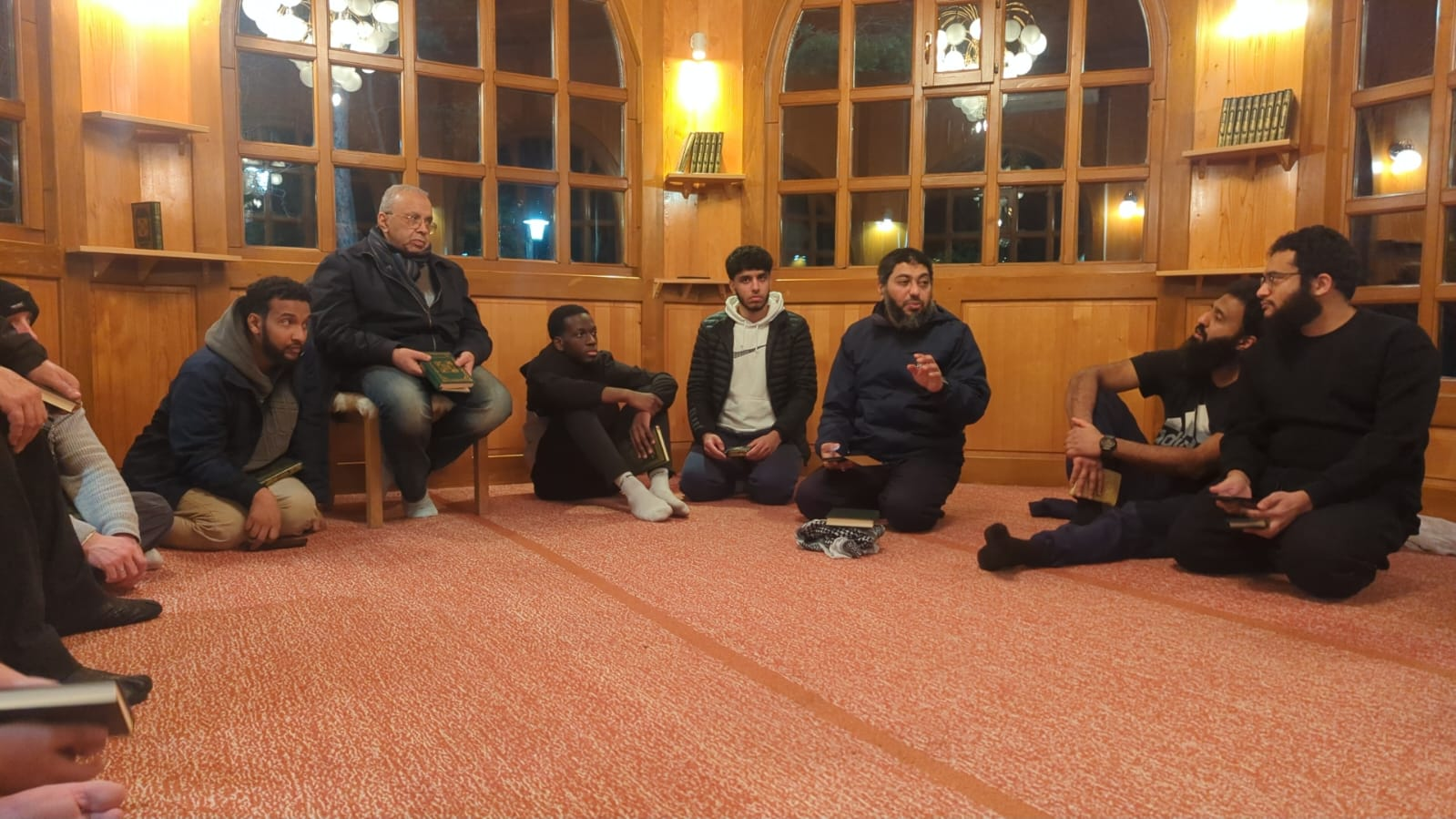Community gathering — Time together in the warmth of a traditional wooden room.